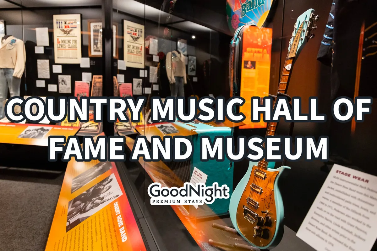 An interior shot of a music exhibit featuring guitars, stage wear, and historical posters. The space feels nostalgic and educational, inviting guests to engage with the city’s legendary country music history.