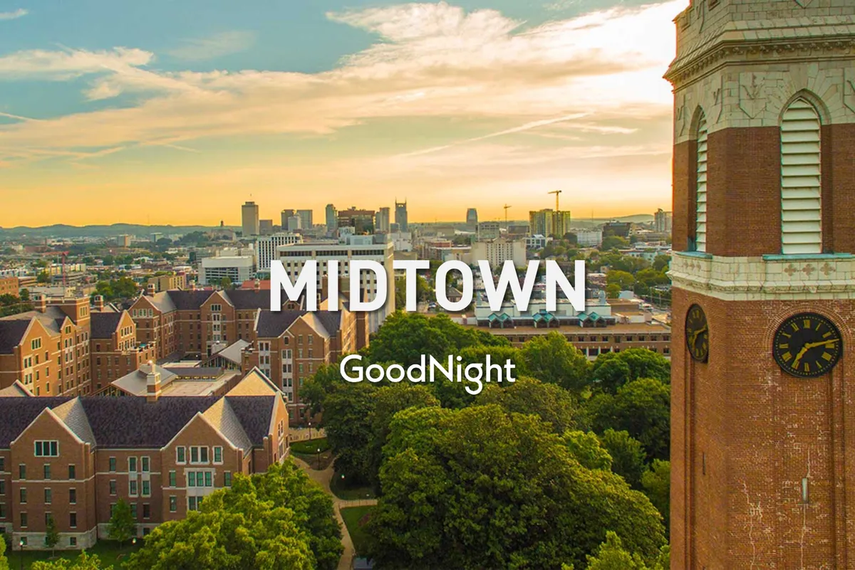 A panoramic view of the Nashville skyline with historic buildings and a clock tower surrounded by lush trees. The tranquil setting is perfect for evening strolls, outdoor dining, or exploring local shops, and it highlights the proximity of Midtown to key city attractions and business hubs.